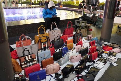 using fake designer products such as bags shoes and clothes|fashion designer handbags scam.